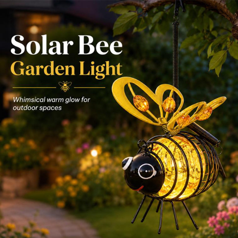 Solar bee garden light glowing in an outdoor space